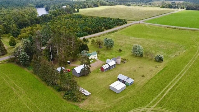 birds eye view of property featuring a water view and a rural view