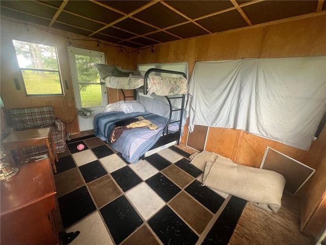 bedroom with wooden walls