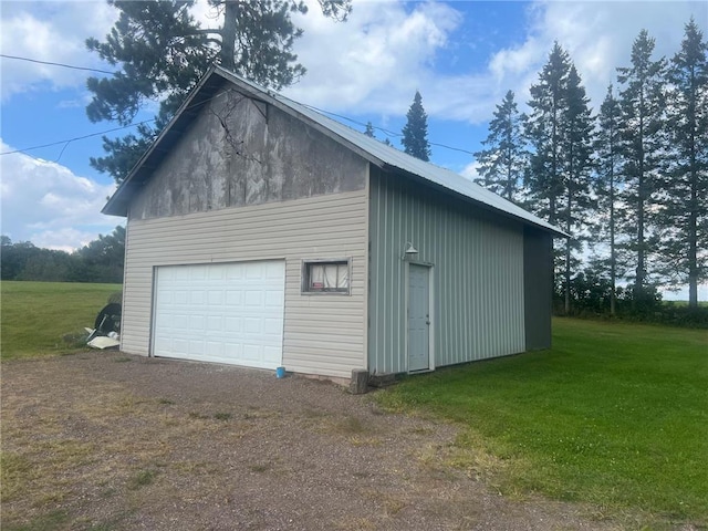 garage featuring a lawn