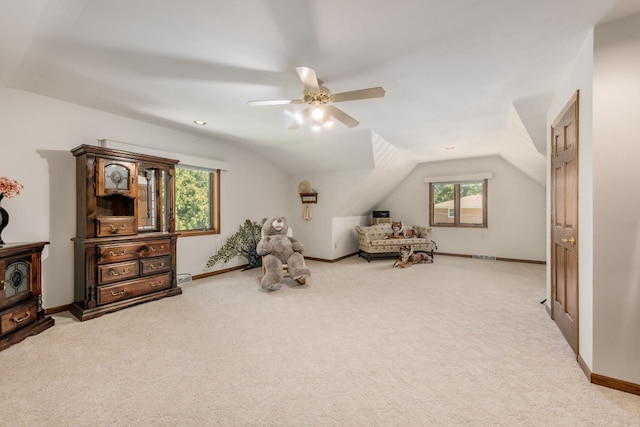 game room featuring baseboards, lofted ceiling, and carpet