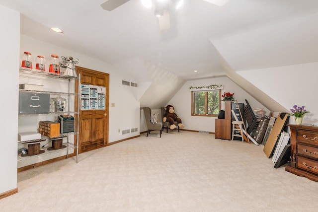 home office featuring visible vents, baseboards, lofted ceiling, and carpet