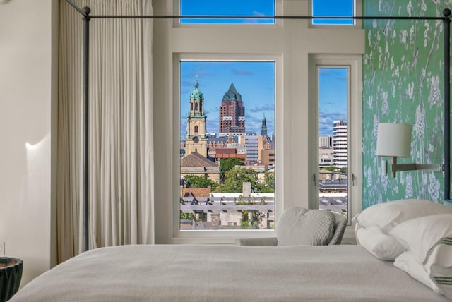 bedroom featuring a city view and access to exterior