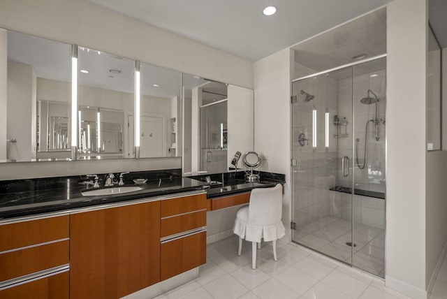 bathroom featuring recessed lighting, a stall shower, and vanity