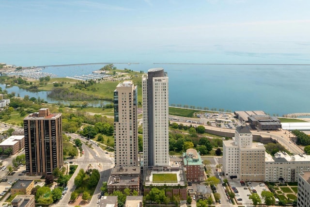 bird's eye view featuring a water view and a city view