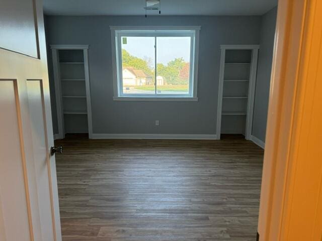 spare room featuring dark hardwood / wood-style floors