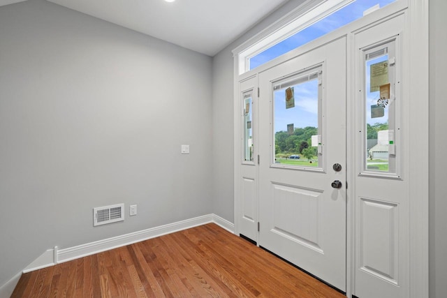 foyer with light hardwood / wood-style flooring