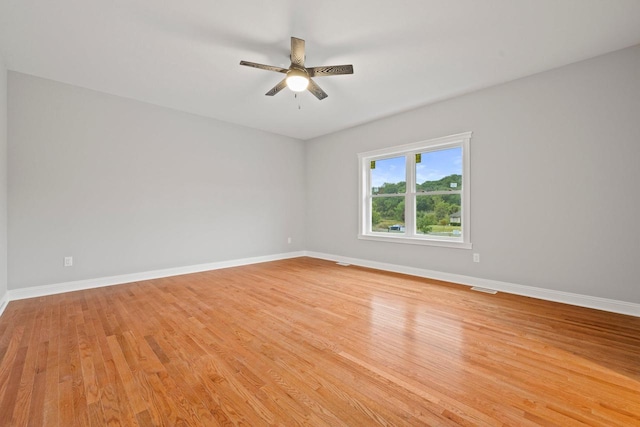 spare room with ceiling fan and light hardwood / wood-style flooring