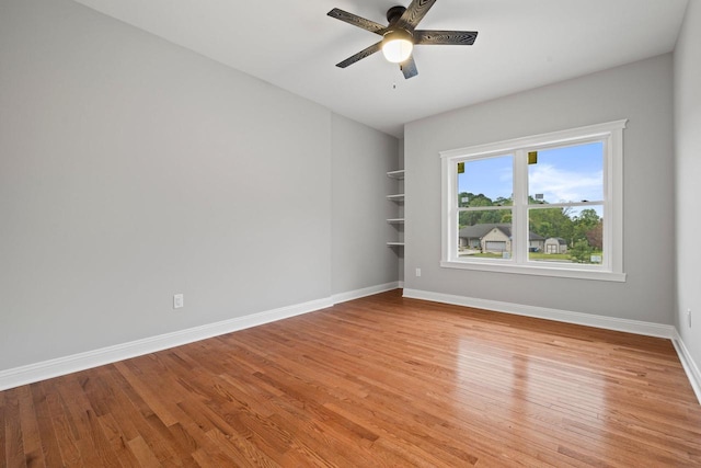 empty room featuring light hardwood / wood-style flooring and ceiling fan