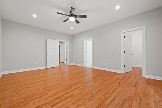 unfurnished room featuring light wood-type flooring and ceiling fan