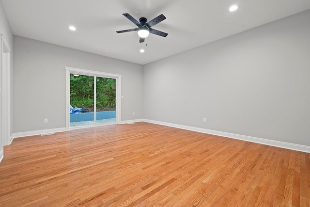 spare room with light hardwood / wood-style floors and ceiling fan