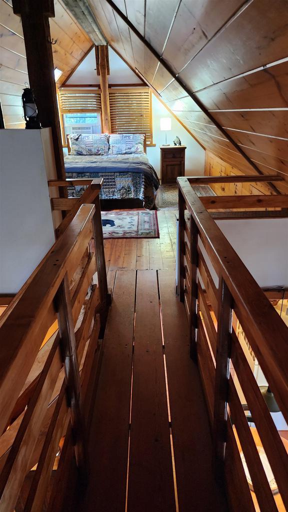 N697 County Rd N, Neshkoro, WI 54960 - bedroom featuring vaulted ceiling and wooden ceiling