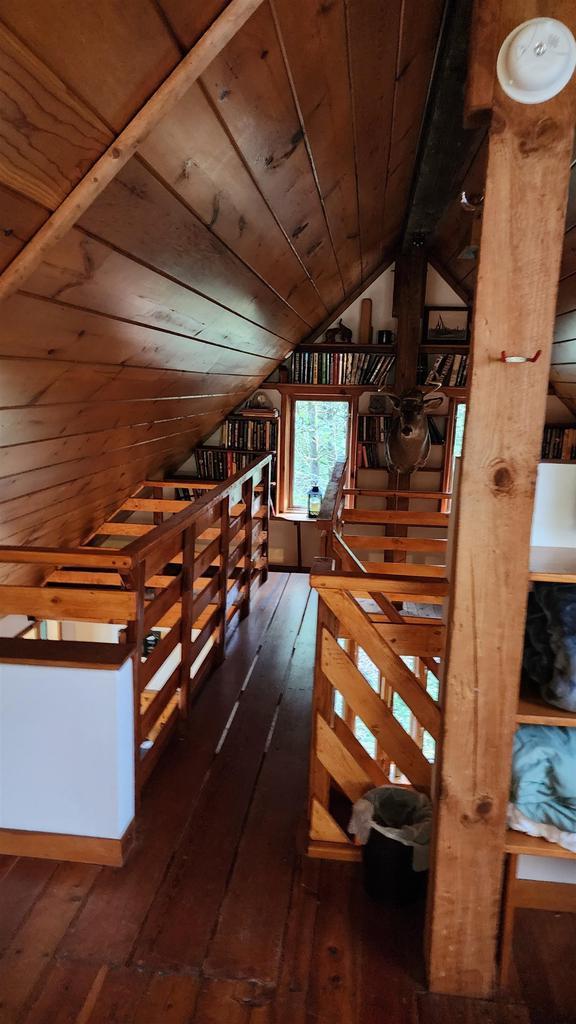 N697 County Rd N, Neshkoro, WI 54960 - additional living space with wooden ceiling, vaulted ceiling, and dark wood-style floors