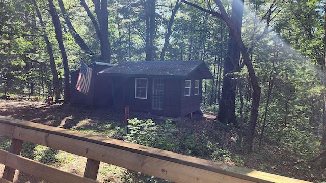 N697 County Rd N, Neshkoro, WI 54960 - view of side of home featuring a view of trees and roof with shingles