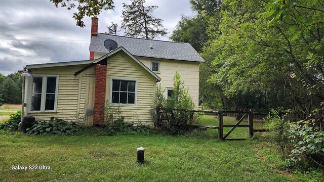 N697 County Rd N, Neshkoro, WI 54960 - back of house with a chimney and roof with shingles