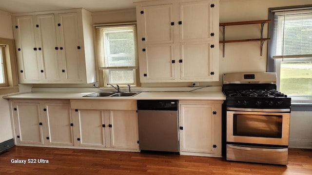 N697 County Rd N, Neshkoro, WI 54960 - kitchen with stainless steel appliances, a sink, and wood finished floors