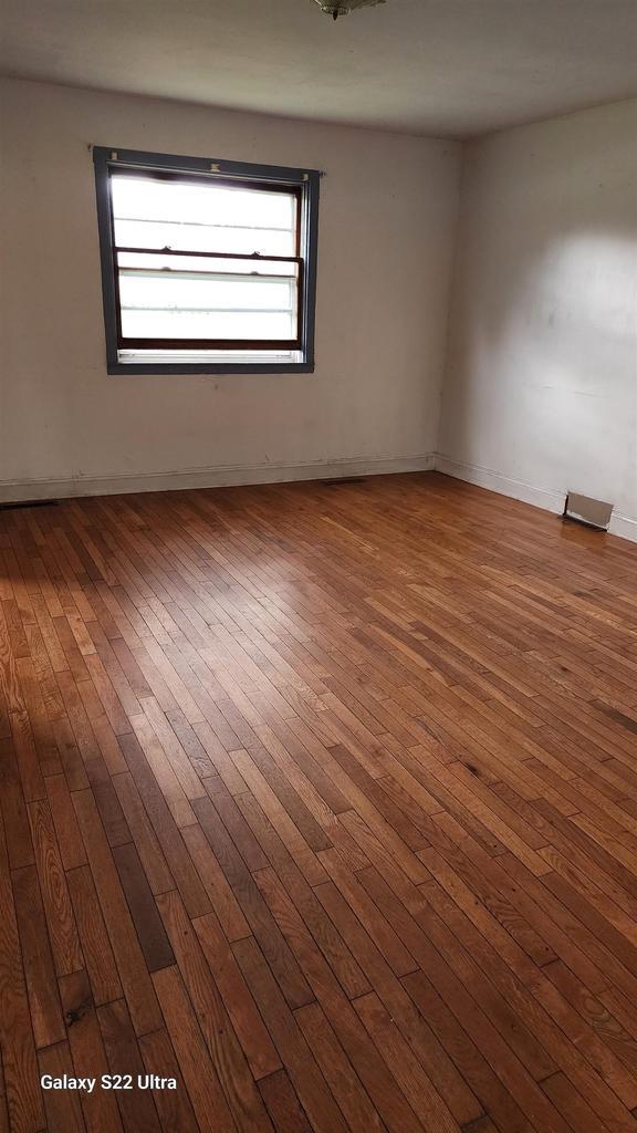 N697 County Rd N, Neshkoro, WI 54960 - empty room featuring hardwood / wood-style flooring and baseboards