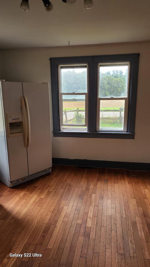 N697 County Rd N, Neshkoro, WI 54960 - unfurnished dining area featuring hardwood / wood-style floors