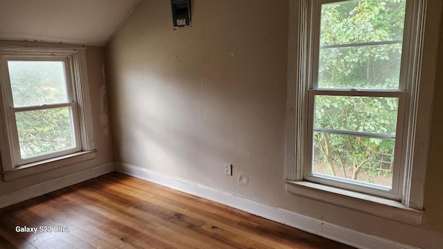 N697 County Rd N, Neshkoro, WI 54960 - empty room featuring lofted ceiling, light wood finished floors, and baseboards