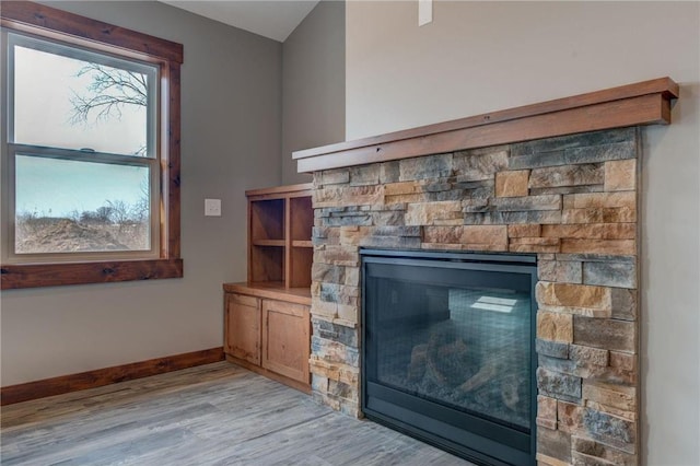 details with a fireplace and hardwood / wood-style floors