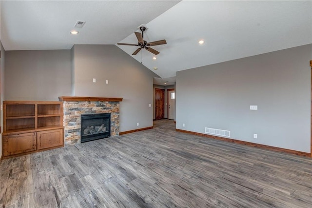 unfurnished living room featuring a fireplace, vaulted ceiling, hardwood / wood-style flooring, and ceiling fan