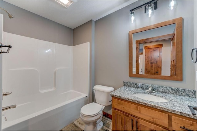 full bathroom with a textured ceiling, vanity, toilet, bathtub / shower combination, and hardwood / wood-style flooring