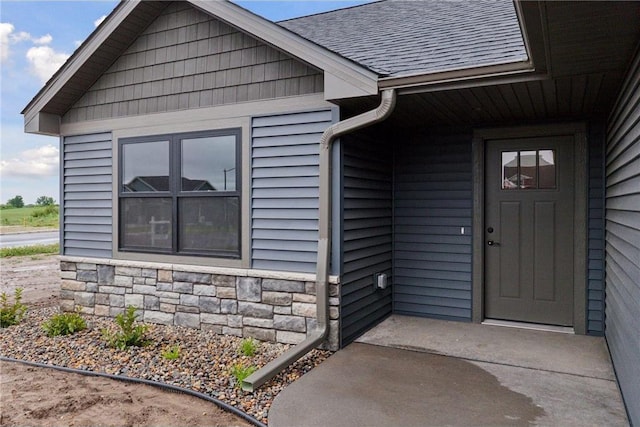 1915 Otter Way, New Richmond, WI 54017 - entrance to property featuring roof with shingles and stone siding