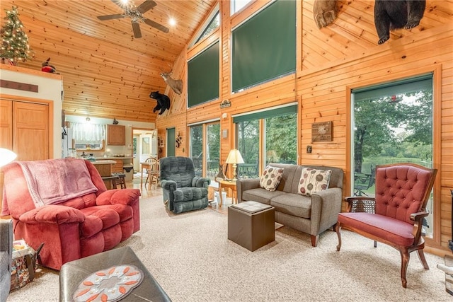 N1071 Ranch Rd, Holcombe, WI 54745 - carpeted living room with wood ceiling, wood walls, and ceiling fan