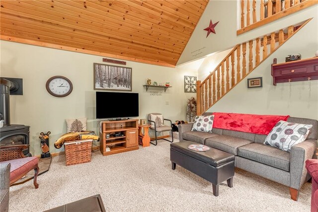 N1071 Ranch Rd, Holcombe, WI 54745 - carpeted living area featuring wood ceiling, high vaulted ceiling, stairway, and a wood stove