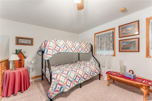 N1071 Ranch Rd, Holcombe, WI 54745 - bedroom featuring a ceiling fan, carpet floors, and baseboards