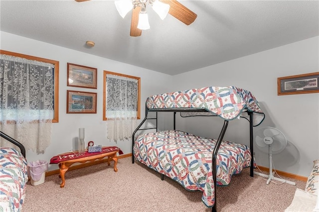 N1071 Ranch Rd, Holcombe, WI 54745 - carpeted bedroom featuring baseboards, a textured ceiling, and ceiling fan