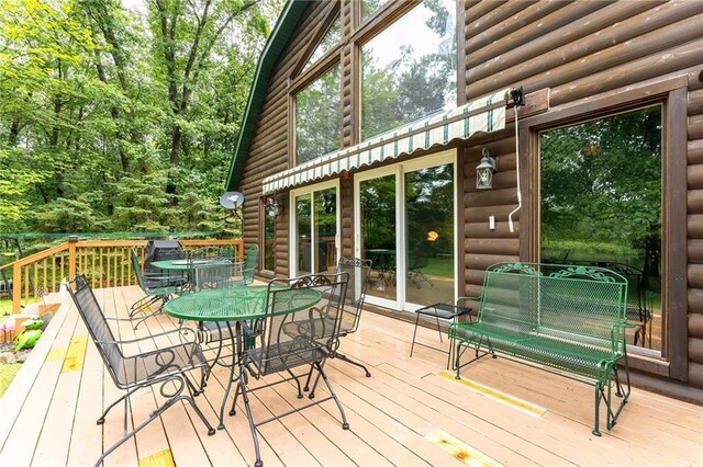 N1071 Ranch Rd, Holcombe, WI 54745 - deck featuring outdoor dining area