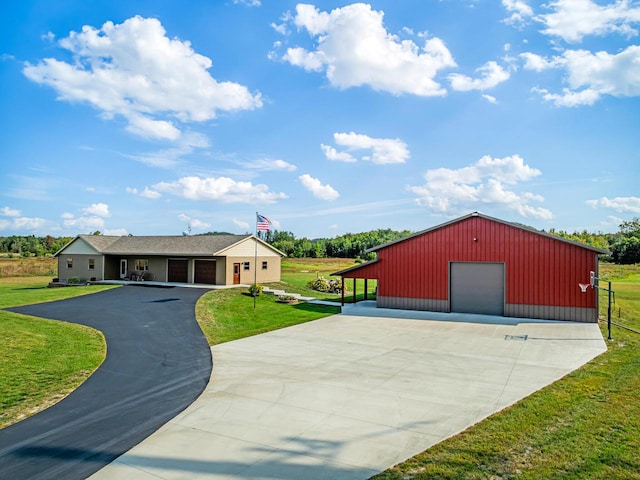 view of outbuilding featuring a yard and a garage