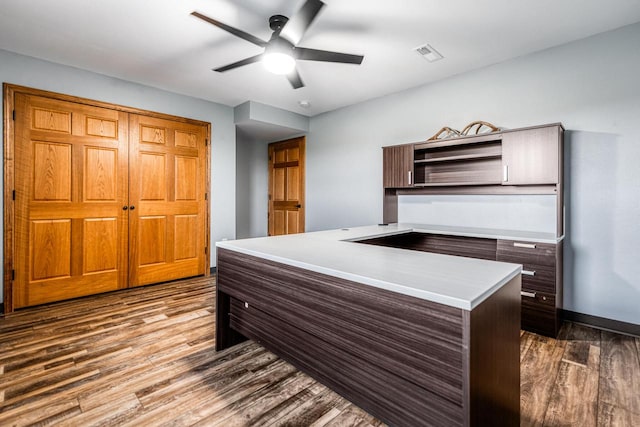 office with hardwood / wood-style floors and ceiling fan