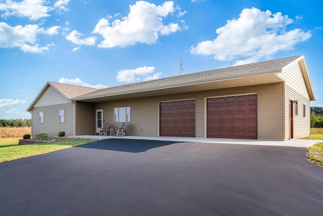 single story home featuring a garage