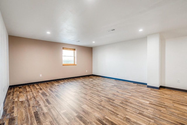 spare room featuring light wood-type flooring