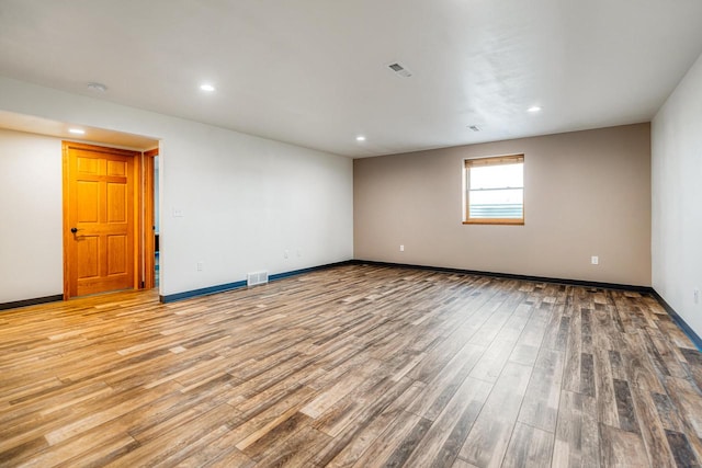 unfurnished room with light hardwood / wood-style flooring