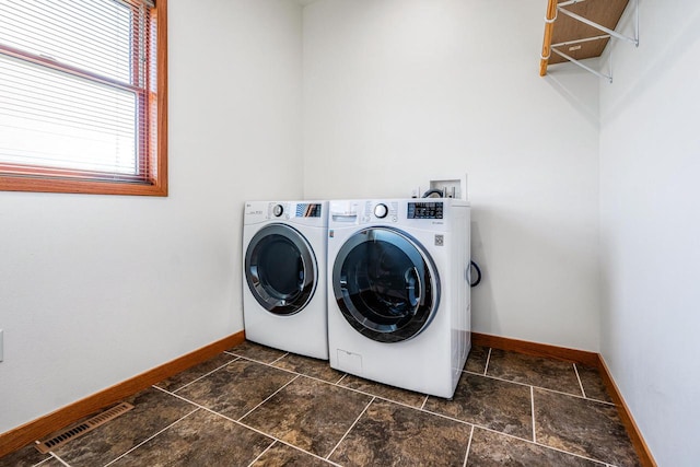 laundry room with washing machine and dryer