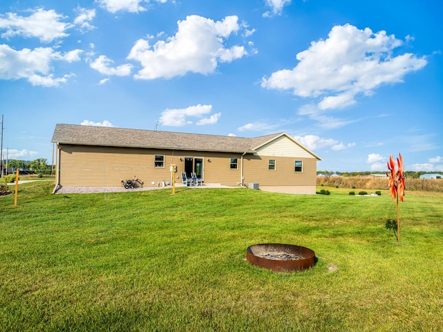 rear view of property with a patio area and a lawn