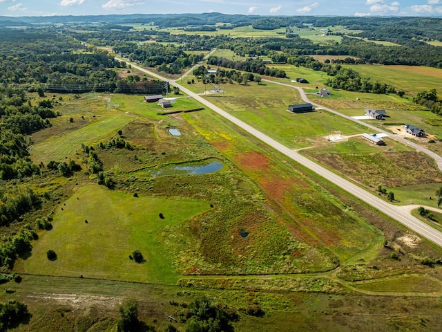 bird's eye view with a water view and a rural view