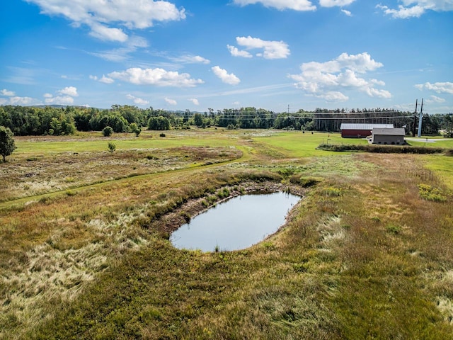 exterior space featuring a water view and a rural view