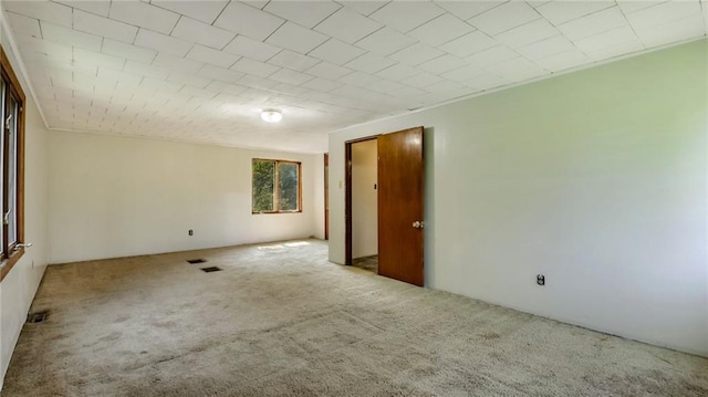 unfurnished room with carpet floors