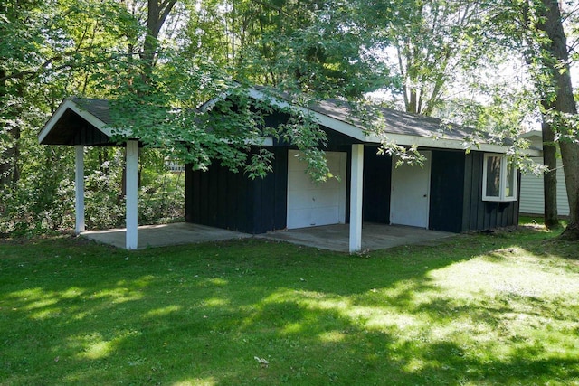 view of outbuilding with a lawn