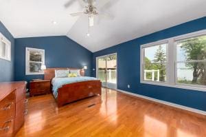 bedroom featuring lofted ceiling, wood-type flooring, and ceiling fan