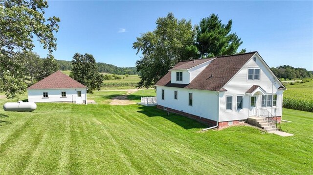 view of side of home featuring a yard