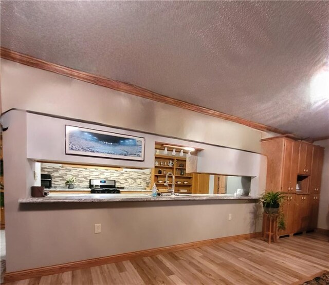 bathroom featuring a textured ceiling, a shower with shower door, toilet, and tile patterned floors