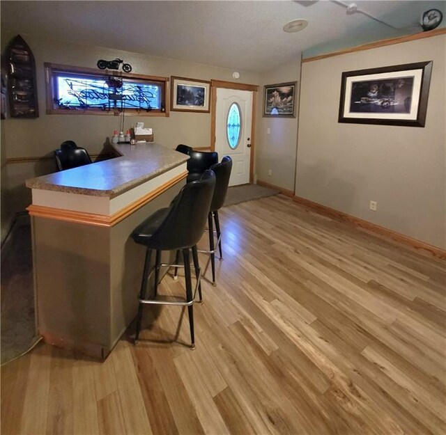 kitchen featuring a textured ceiling, tasteful backsplash, stainless steel appliances, sink, and light stone counters