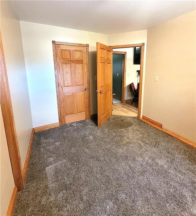 unfurnished bedroom with carpet floors