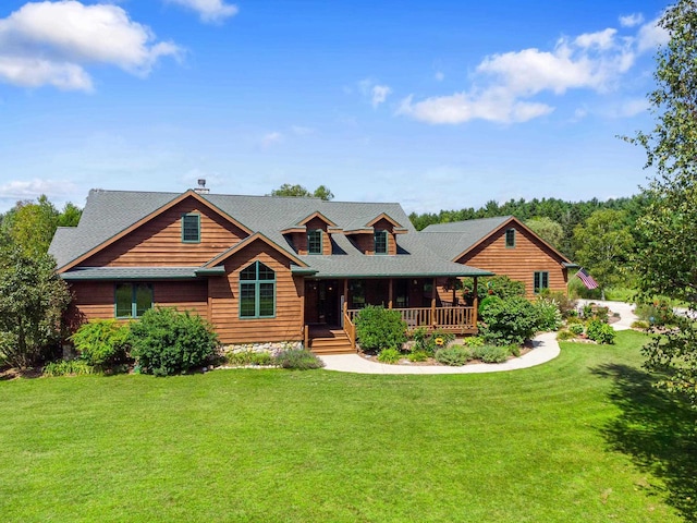 log home with a front lawn and covered porch