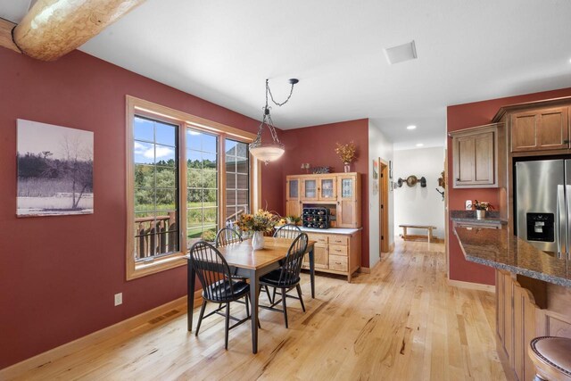 dining room with recessed lighting, visible vents, baseboards, and light wood finished floors