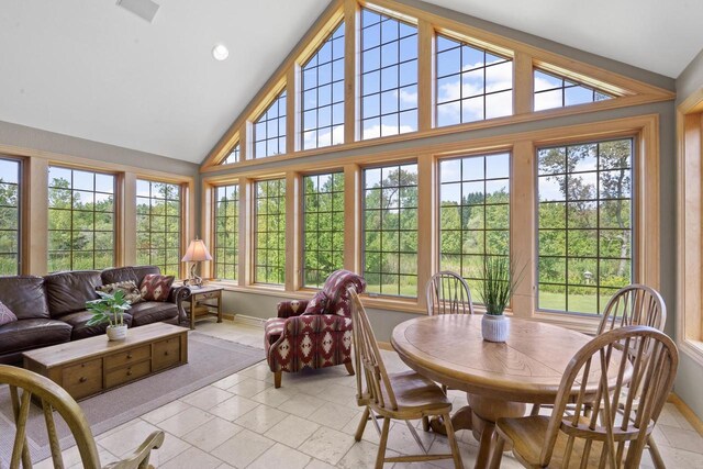 sunroom featuring lofted ceiling